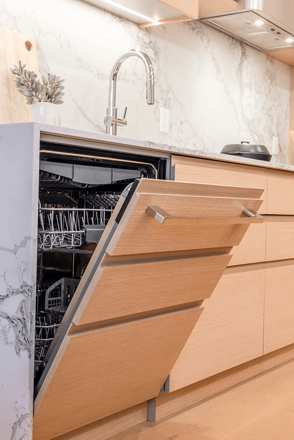 Anticipate — installed cabinetry with open microwave and pull-out organizer drawer